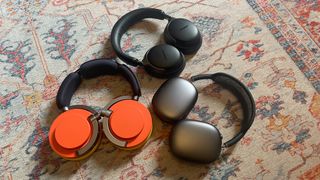 Dyson OnTrac, Bose QuietComfort Ultra Headphones and Apple AirPods Max on carpet
